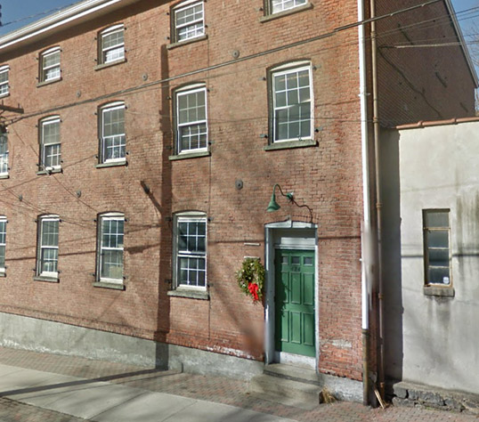 Outside shot of UFN's modest first office building in Peekskill, New York.